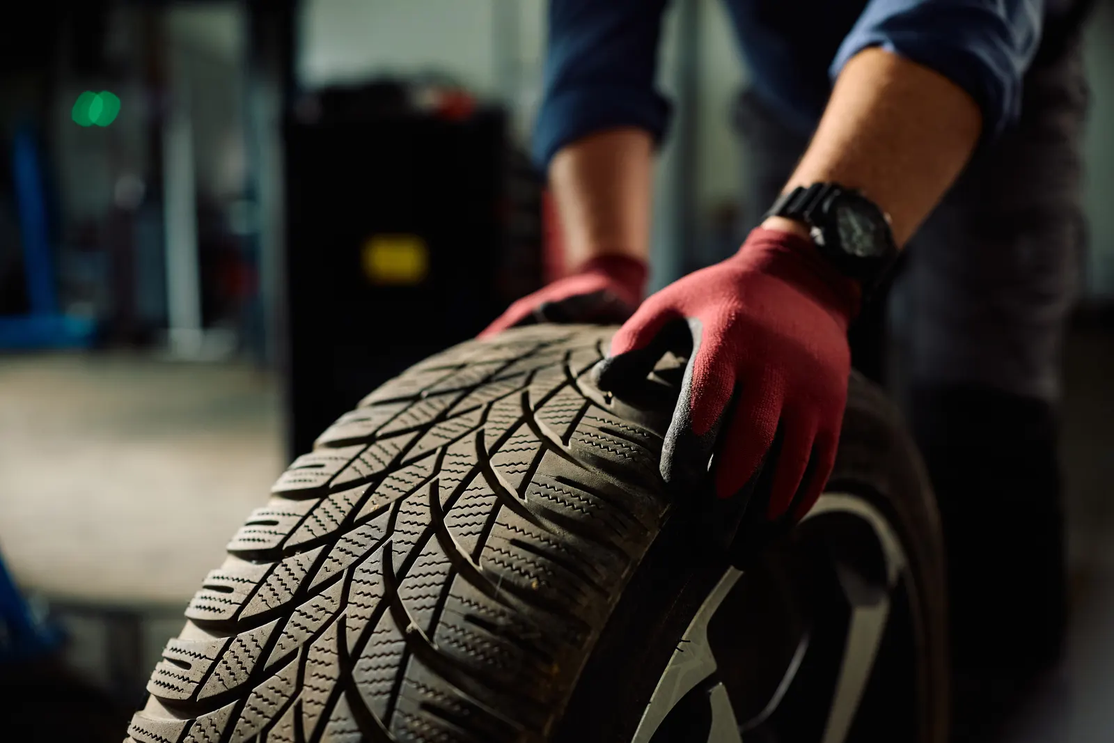 Checking the condition of a tyre in the workshop