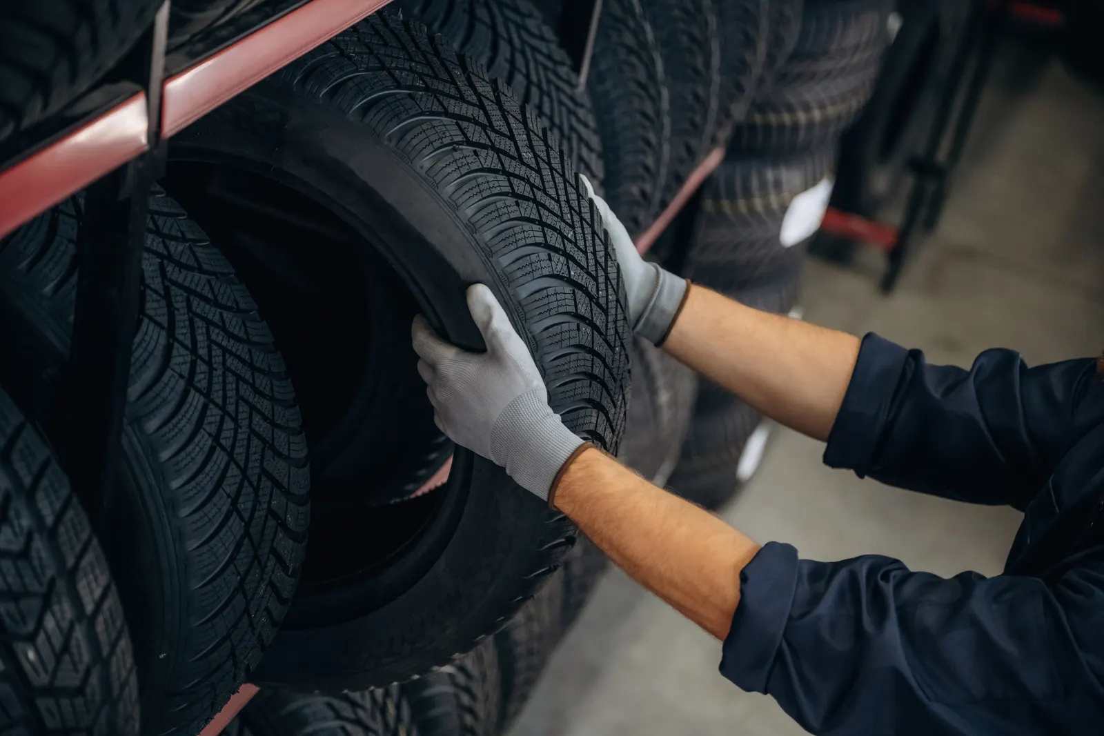 Mechanic fitting a tyre in the workshop